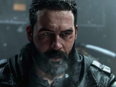Call of Duty: Modern Warfare 4 promotional still of a bearded, scarred soldier in a dark jacket staring at the camera in a dim, rainy setting.