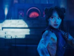 Callina Liang as Chun-Li in a fighting stance under blue light in a scene from the Street Fighter movie
