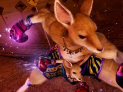 Roger Jr. and his mother, a boxing kangaroo in purple gloves and a "Mum" necklace, mid-punch in a Tekken 8 outback stage with kangaroo road signs